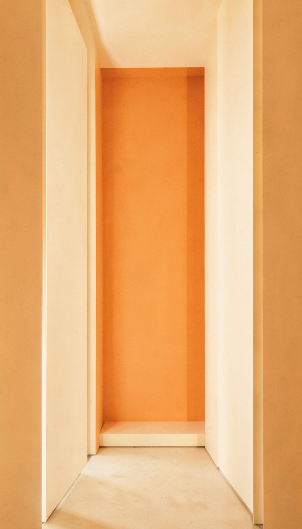 A book-cover-style image with warm amber and cream tones, soft and contemplative