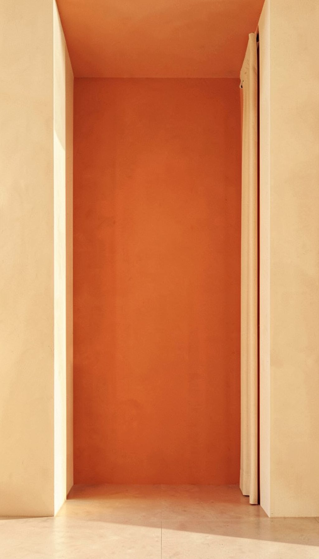 A book-cover-style image with warm terracotta and ivory tones, inviting and worldly